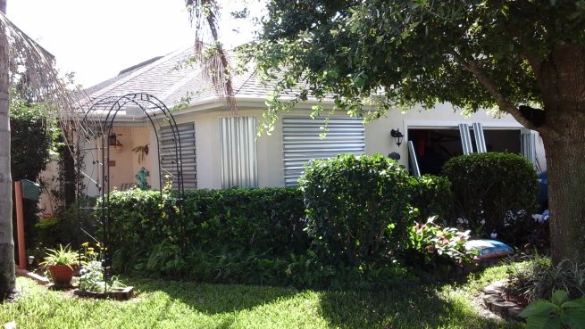 Putting up hurricane shutters